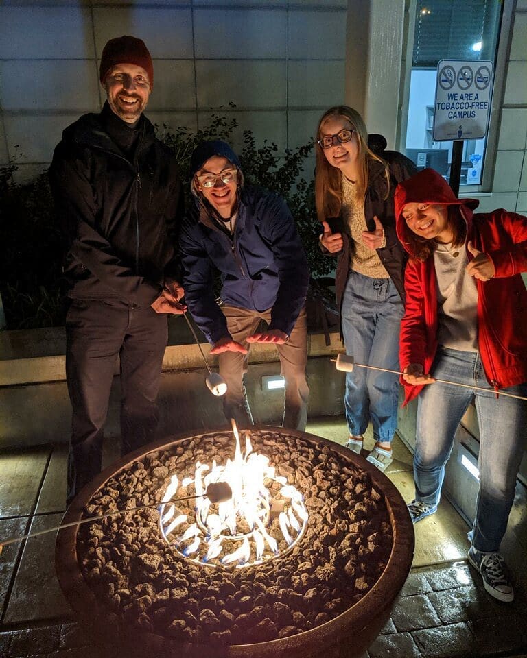 Fr. Laramie, left, with his students at Saint Louis University.